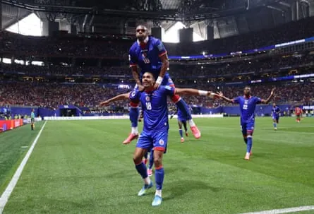 Haiti’s Wilson Isidor celebrates scoring their second goal with Lenny Joseph.