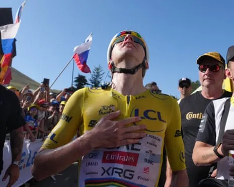 Slovenia's Tadej Pogacar looks to the sky after his incredible stage win on Alpe d’Huez